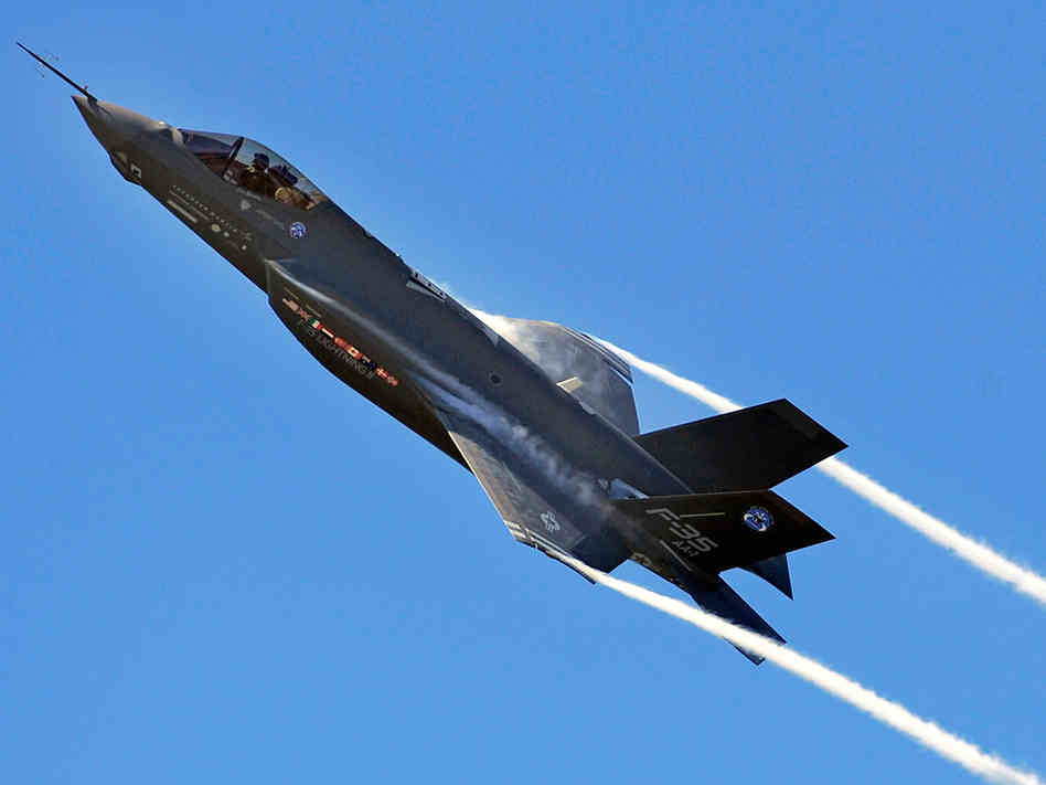 An F-35 Lightning II joint strike fighter banks during a test flight at Eglin Air Force Base in Florida, where pilots will eventually train on the aircraft. (Photo by Senior Airman Julianne Showalter/U.S. Air Force via NPR)