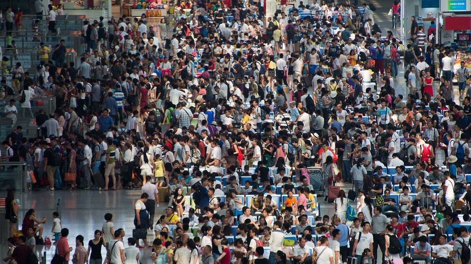 Passengers packed the waiting hall Tuesday at Hongqiao Railway Station, which services a terminal at Shanghai Hongqiao International Airport. Johannes Eisele/AFP/Getty Images