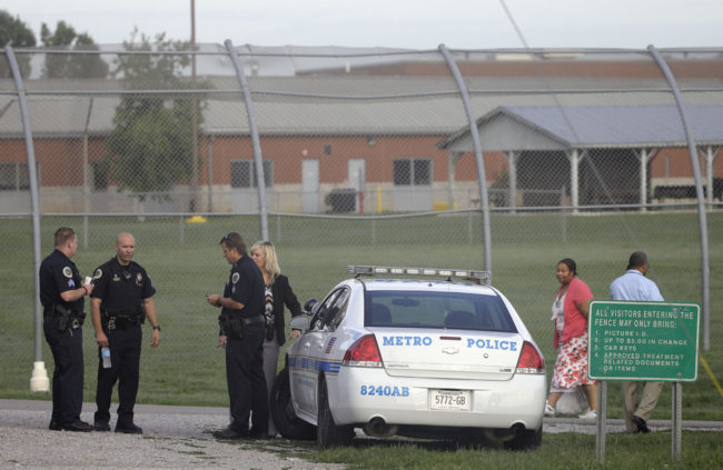 Police work in front of the Woodland Hills Youth Development Center on Tuesday in Nashville, Tenn. Mark Humphrey/AP