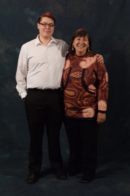 Jacob Taug and his aunt, Valerie Davidson, who said, "I almost always wear kuspuks. They’re very comfortable. They remind me of my grandmother." (Photo by Skip Gray/KTOO)