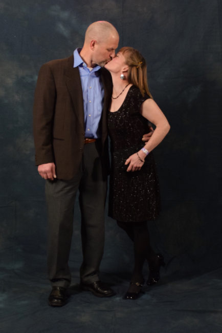 Bob Sauerteig and Suzanne McGee. Sauerteig bought his jacket for $5 at a thrift shop in Philadelphia for his 25th high school reunion. McGee borrowed her dress from friend Rebecca Braun. Her earrings and raven bracelet are made by artist Donald Gregory. (Photo by Skip Gray/KTOO)