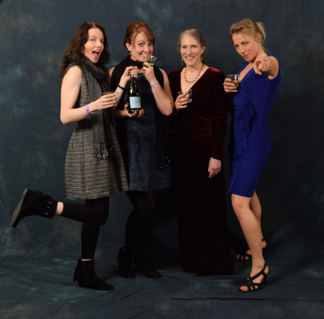 Lindsey Bray, Marisha Bourgeois, Kathy Coghill and Adrienne Antoni are coworkers at Bartlett Regional Hospital. They had a pre-party to get dressed up, drink wine and snack on smoked salmon. (Photo by Skip Gray/KTOO)