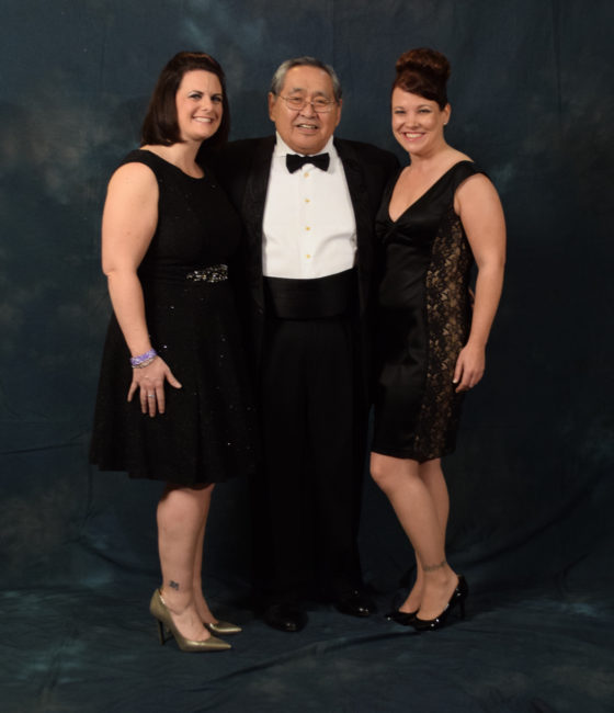Sam Kito Jr. and two beautiful women. Kito wore a suit jacket with lovebirds embroidered on the lapel by Hydaburg artist Dorothy Grant. (Photo by Skip Gray/KTOO)