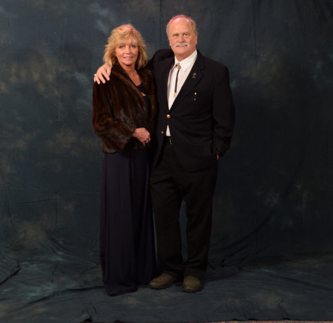 Tracy and Don Kubley. Tracy wore a mink coat, a gift from Don's mother. Don's bolo tie belonged to his grandfather. Don and Tracy are both fourth generation Alaskans. (Photo by Skip Gray/KTOO)