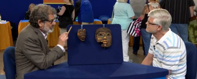 Appraiser Tim Trotta with the unidentified owner of the masks.