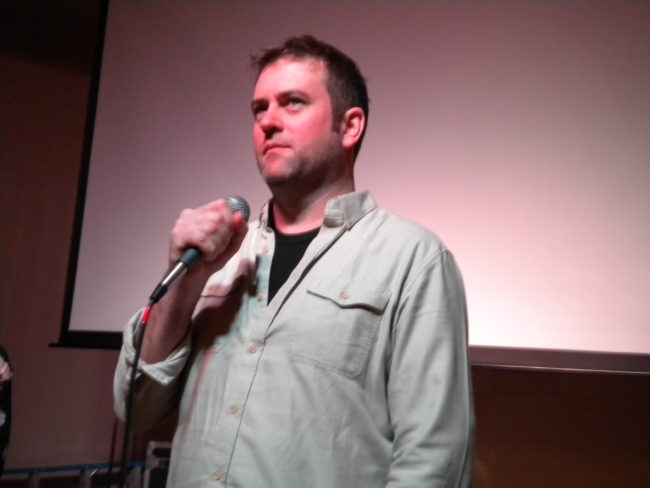 Mark Titus speaking to the audience of his film "The Breach" on Friday at the Rockwell Ballroom in downtown Juneau. The documentary chronicles mankind's history of exploiting salmon populations. (Photo by Kevin Reagan/ KTOO)