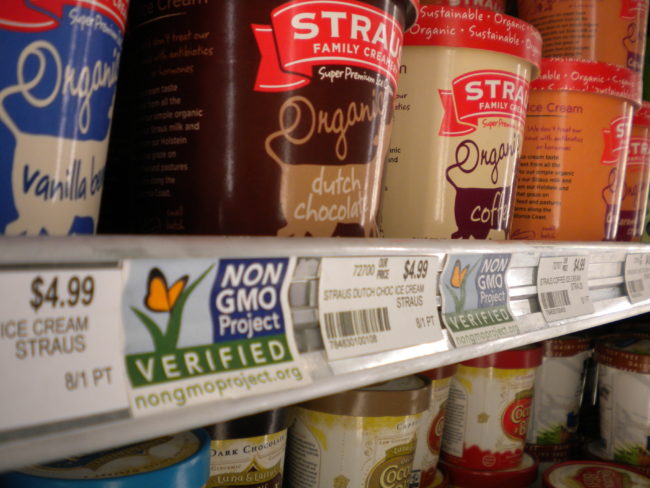 Rainbow Foods in downtown Juneau labels while products and do not contain genetically-modified organisms. House Bill 92 aims to require all foods sold in Alaska to have such labels. (Photo by Kevin Reagan / KTOO)