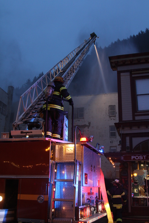 Capital City Fire/Rescue battles Saturday's fire at the Gastineau Apartments building. (Photo by Mikko Wilson/KTOO)