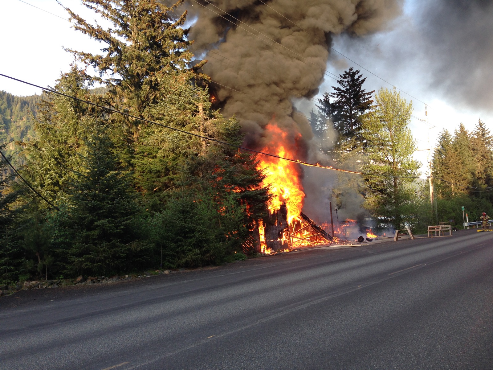 A structure fire along North Douglas Highway near mile 3, May 14, 2015. (Photo by Casey Kelly/KTOO)