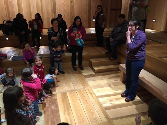 Inside the clan house at the Walter Soboleff Building, Mary Folletti sings familiar sounding songs with Tlingit lyrics. (Photo by Lisa Phu/KTOO)