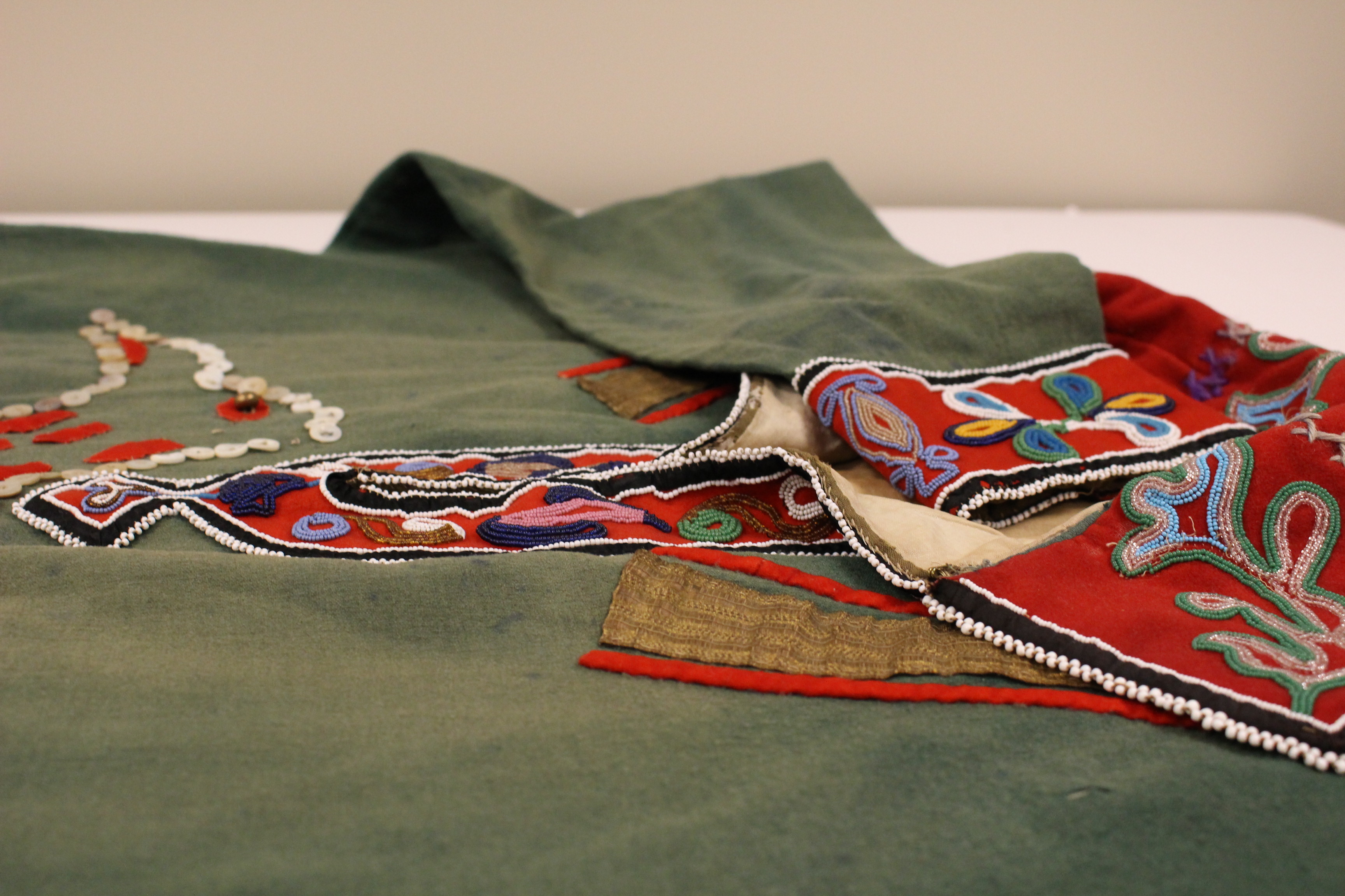 This tunic was repatriated from a museum in 2007. Although it's of Southeast origin, the tribe is unknown. (Photo by Elizabeth Jenkins/KTOO)