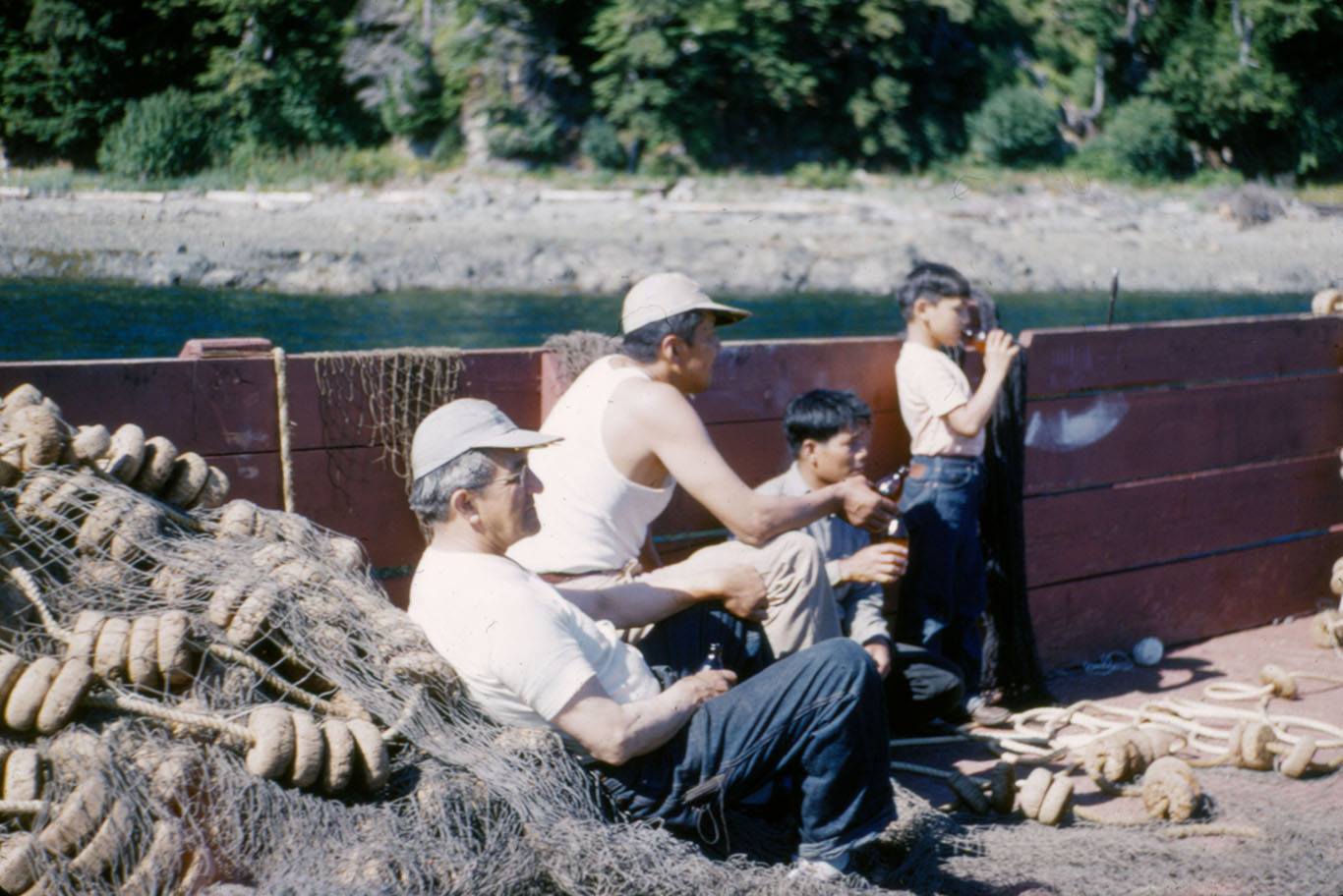 William L. Paul Sr. (left) with Walter Soboleff, M. Quinto and Ray Peck on a boat. (Photo courtesy of Sealaska Heritage)