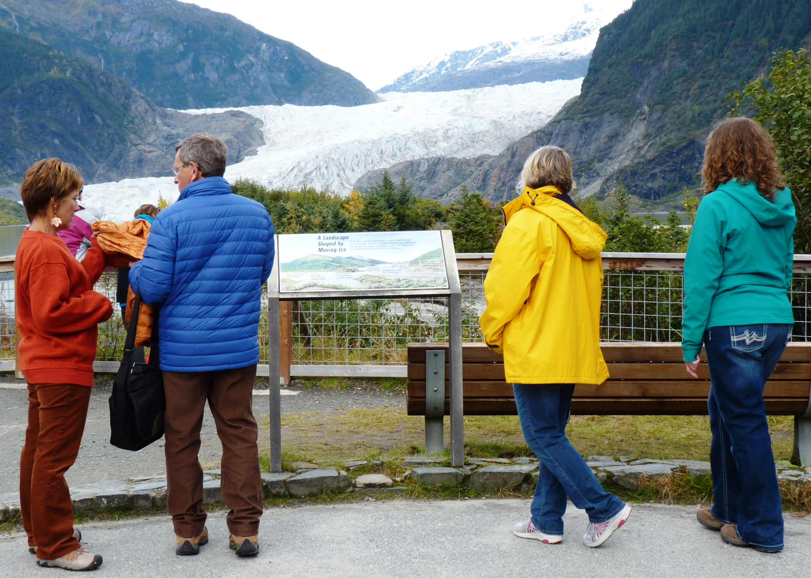 9-22-15 Tourists check out the A Landscape Shaped By Moving Ice sign at the Mendenhall Glacier