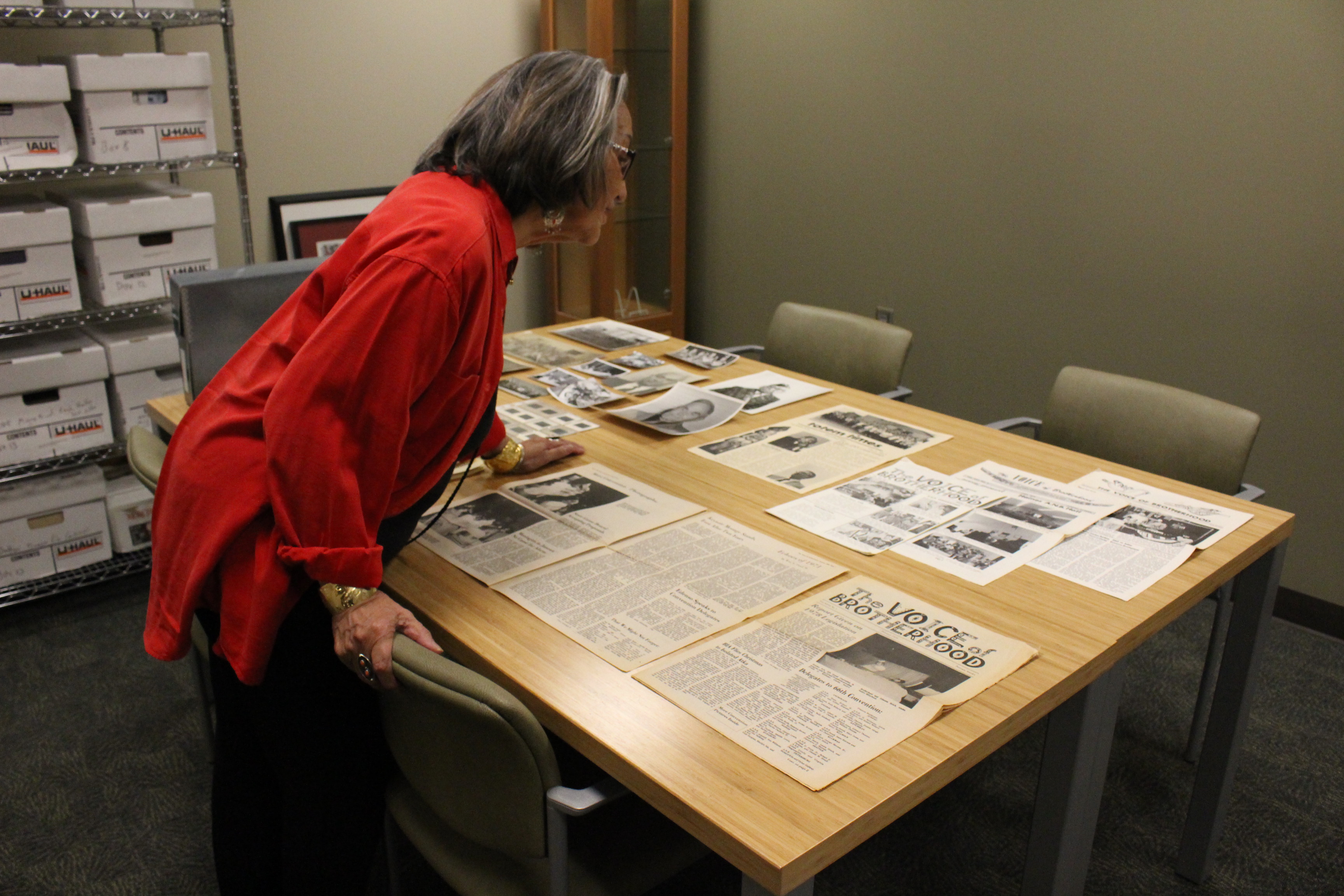Rosita Worl marvels over the donated collection in the William Paul Archives. (Photo by Elizabeth Jenkins/KTOO)