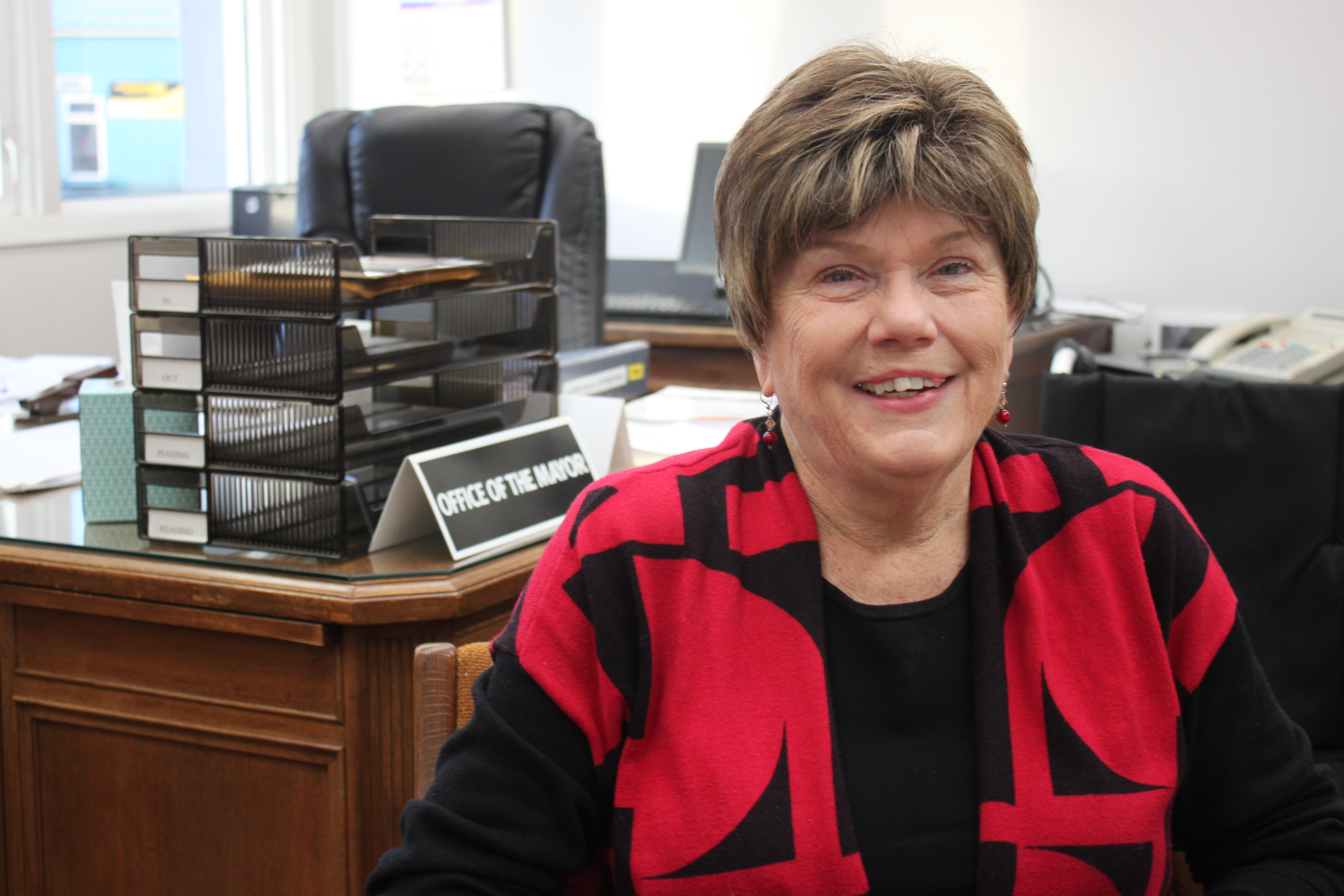 Mary Becker sits in the office of the mayor at Juneau's City Hall on Dec. 3, 2015. (Photo by Lisa Phu/KTOO)