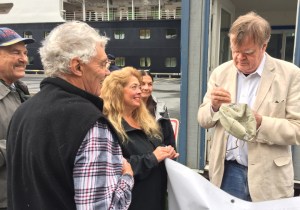 Retired A Prairie Home Companion host Garrison Keillor, right, signs autographs for fans while visiting Kodiak on August 24, 2016. (Photo by Jay Barrett/KMXT-Kodiak)