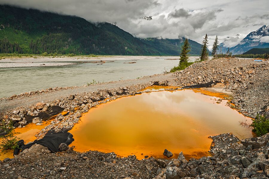 2013-acid-drainage-from-the-tulsequah-chief-mine-discolors-a-leaking-containment-pond-next-to-the-tulsequah-river-in-british-columbia-chris-miller-tu