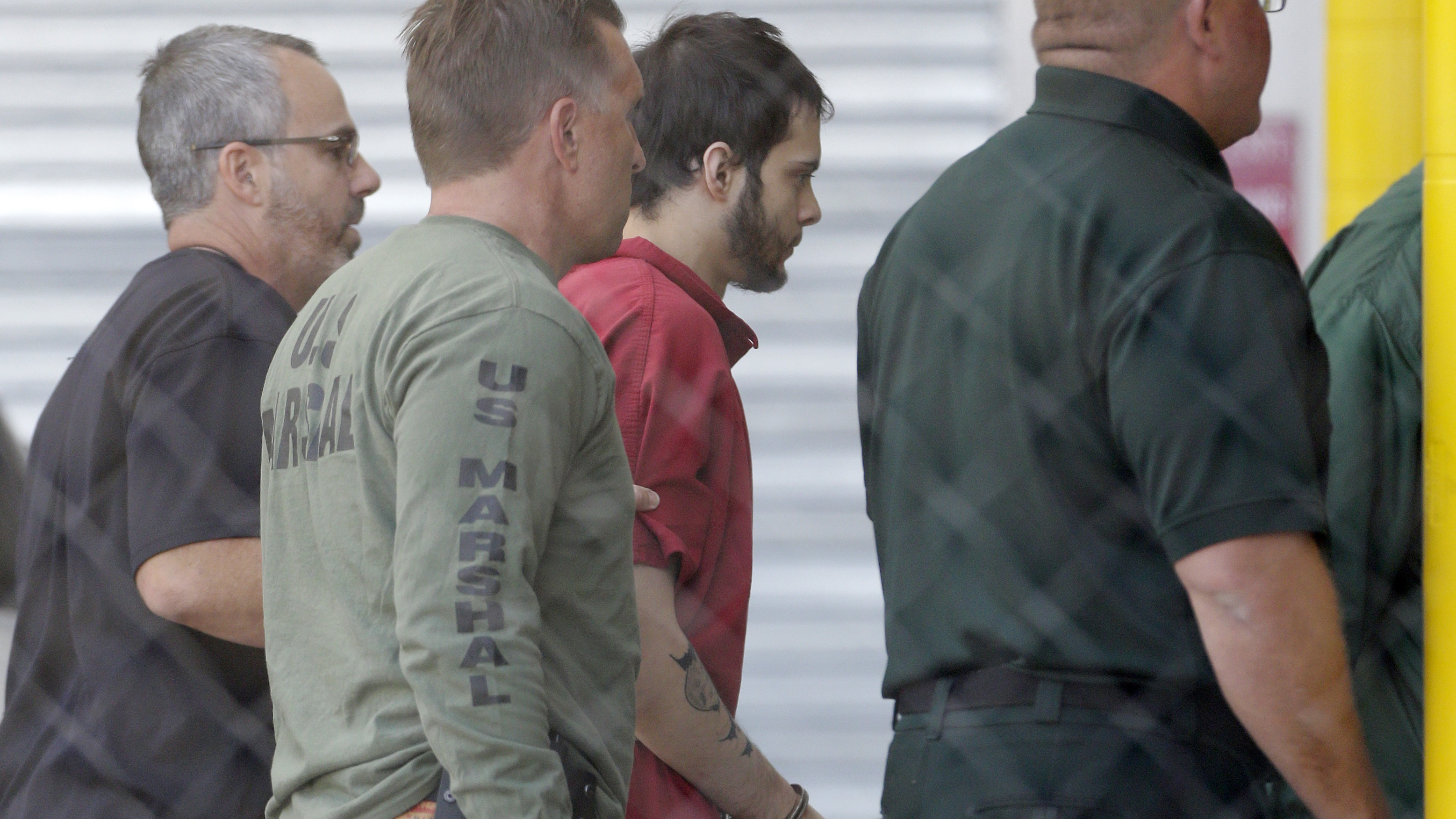 Accused airport shooter assigned a public defender at first court appearance