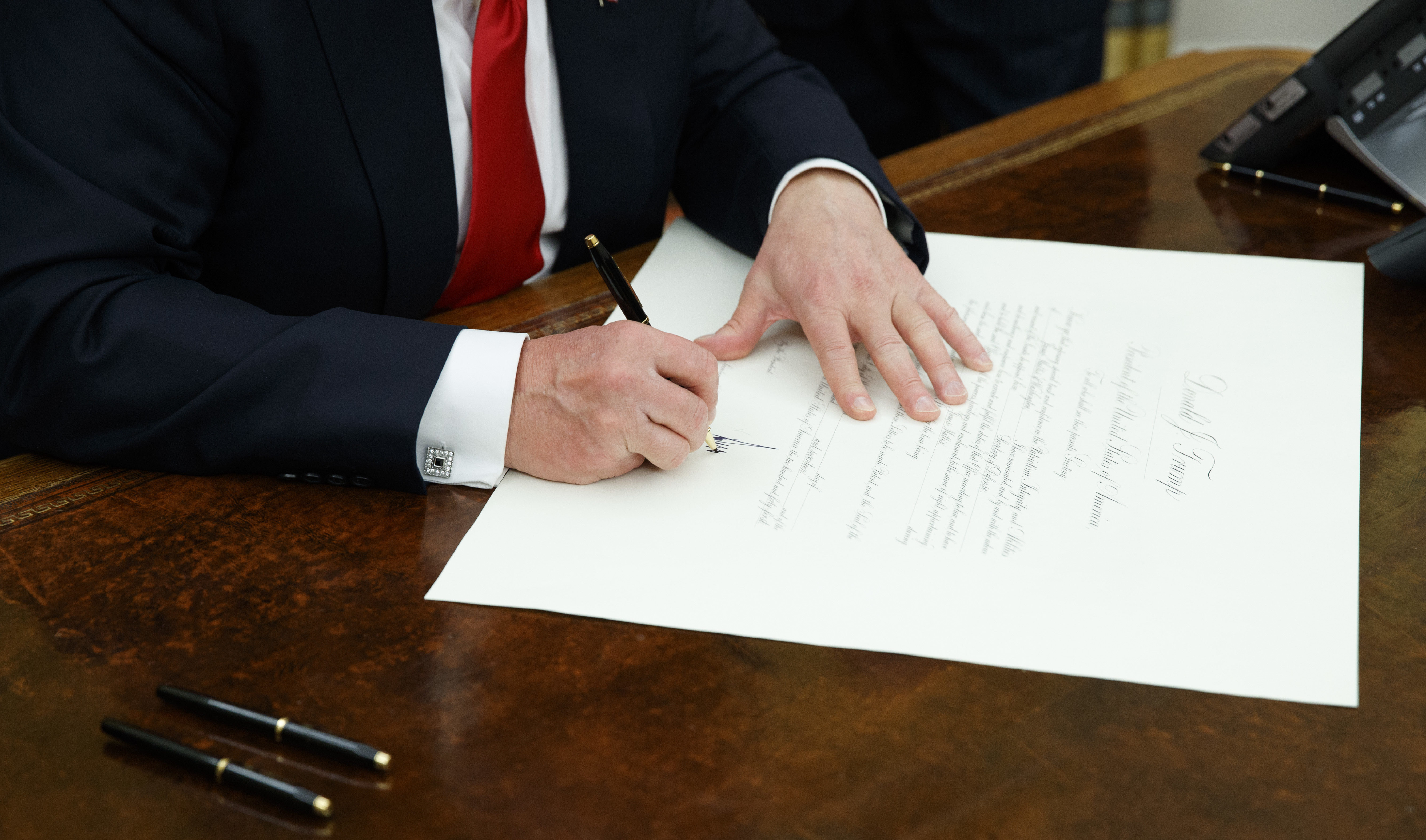 Trump Signs Executive Order To ‘Ease The Burdens Of Obamacare’