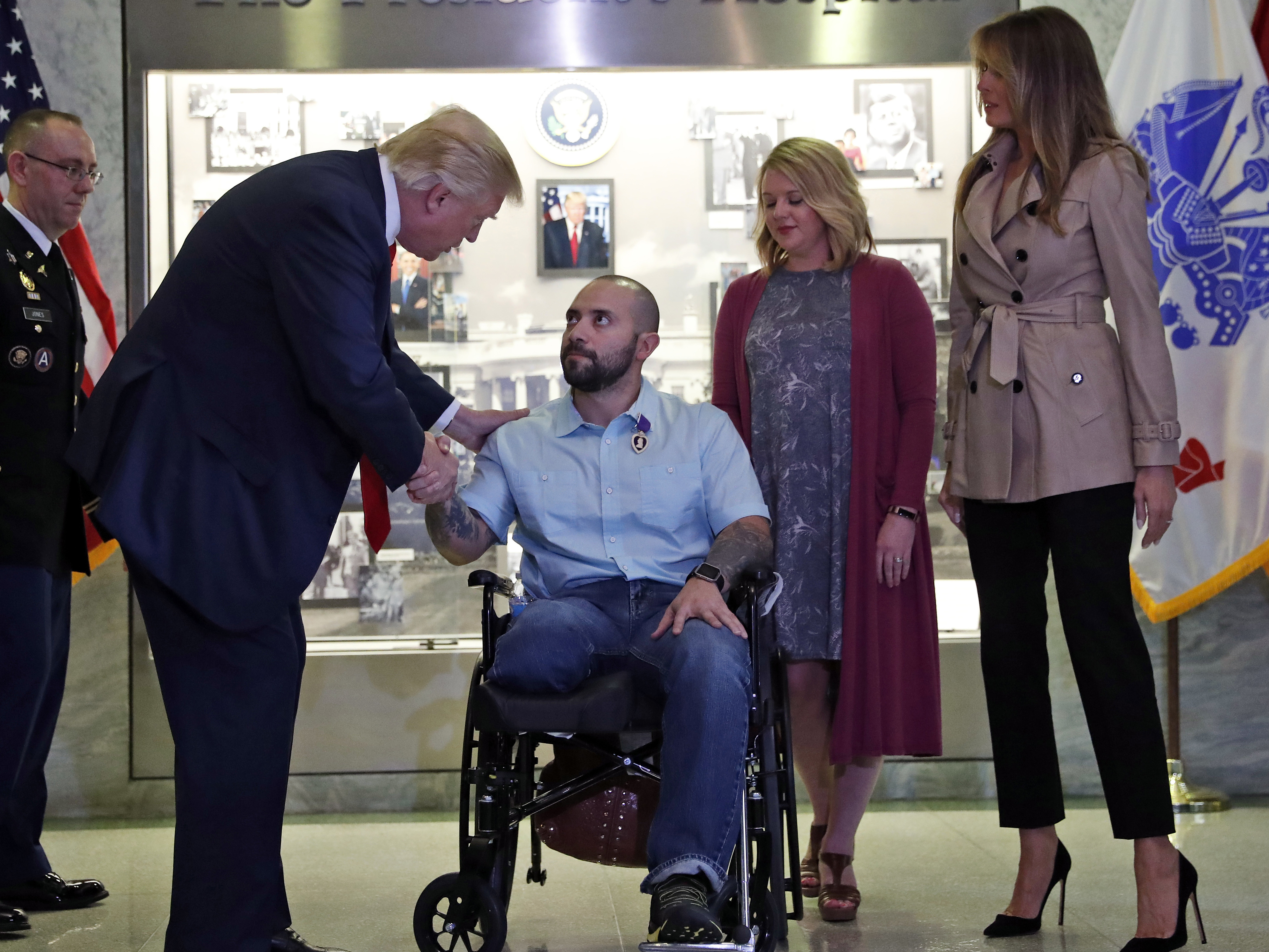 Trump awards purple heart in first visit to Walter Reed Military Hospital