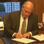 Gov. Bill Walker signs a proclamation for a special session focused on the budget and long-term spending plan, after lawmakers failed to compromise. May 17, 2017. (Photo by Andrew Kitchenman/KTOO/Alaska Public Media)