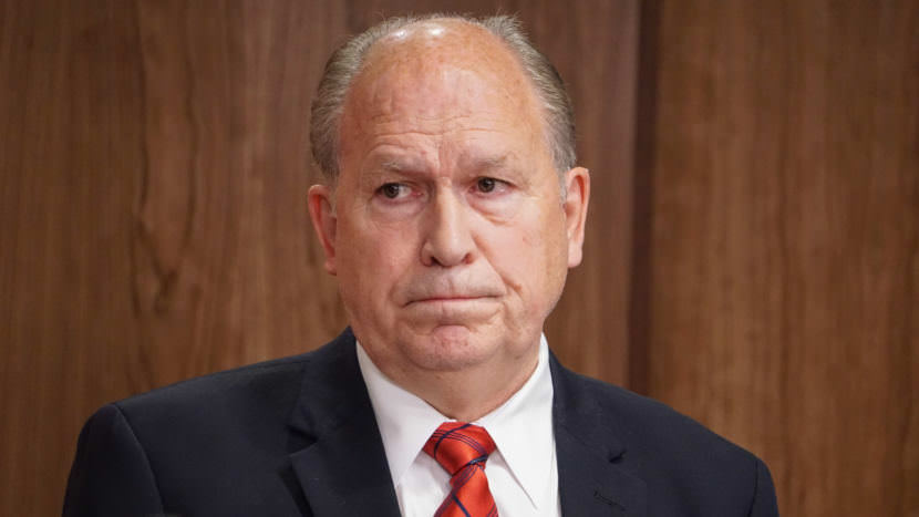 Alaska Gov. Bill Walker listens as Department of Revenue Commissioner Randall Hoffbeck discusses a compromise budget proposal with reporters in the cabinet room of the Capitol in Juneau on June 6, 2017. (Photo by Jeremy Hsieh/KTOO)