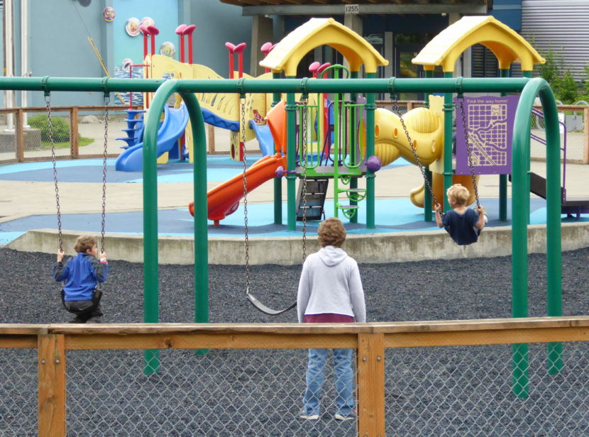 Juneau kids play on the playground in front of Harborview Elementary School on Wednesday.