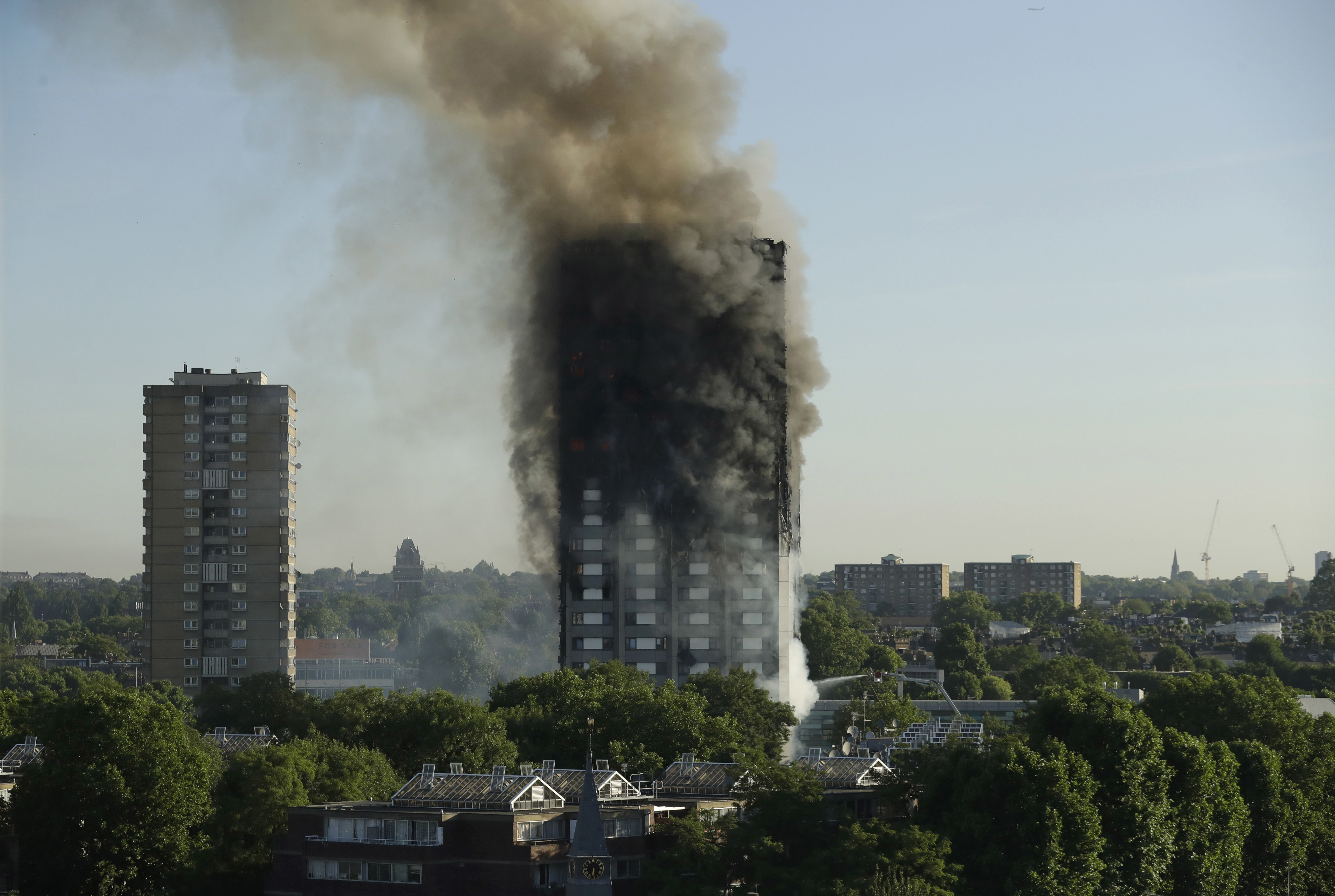 After deadly high-rise inferno, London searches for survivors — and answers
