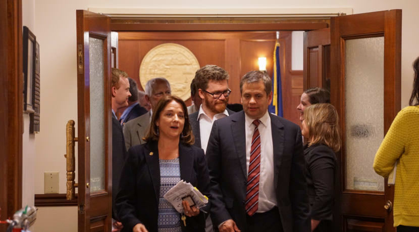 Reps. Lora Reinbold, R-Eagle River, and Chris Tuck, D-Anchorage, talk as they leave House Chambers just after midnight on July 15, 2017. The House had just adjourned the special session.