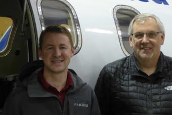 LifeMed Alaska CFO Jared Sherman, left, and LifeMed CEO Scott Kirby stand in front of a Learjet housed in Juneau on Friday, Aug. 11, 2017.