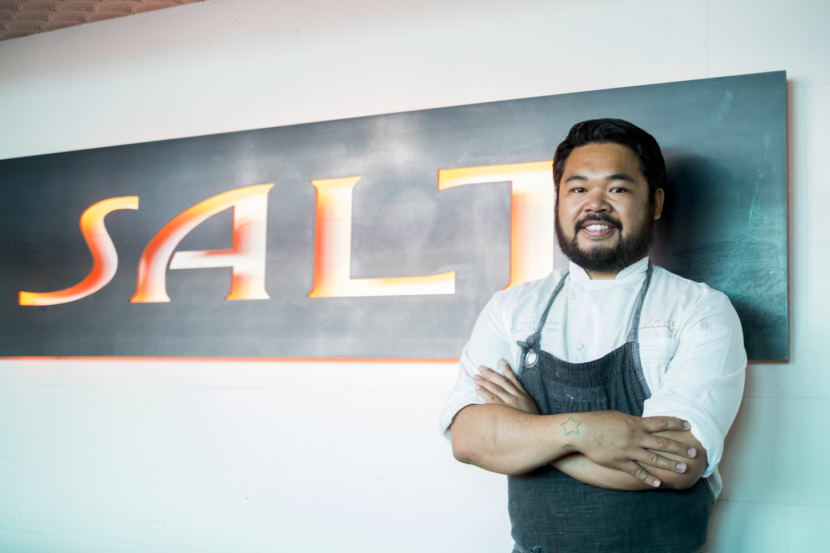 Chef Lionel Uddipa stands inside the downtown restaurant Salt in Juneau on August 10, 2017. His winning dish of Bristol Bay king crab with risotto took first place at the Great American Seafood Cook-Off in New Orleans. (Photo by Annie Bartholomew/KTOO)