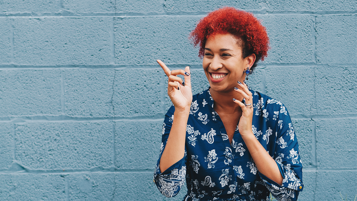 Brand-Led Culture: Woman smiling with red hair