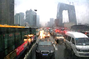 Caught in traffic - Bejing 2008 Traffic on a dreary day in Beijing in 2008. Photo by Noel back in Zurich, via Flickr.