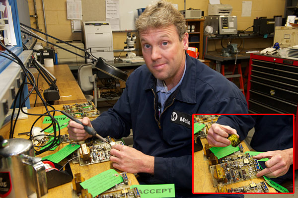 Electronics shop Maintenance specialist Steve Parker modifies a circuit board. Parker and co-worker Gordon Lancaster keep the shop in stock in hard-to-find circuitry replacement parts.