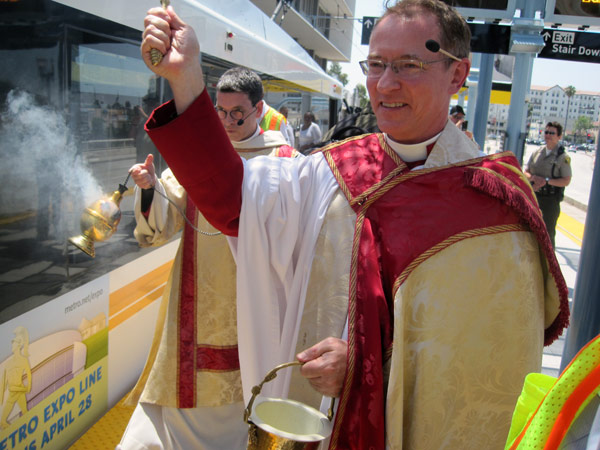 Expo blessing The Very Reverend Canon Mark R. Kowalewski, dean and rector of St. John's Cathedral, leads the blessing ceremony at the 23rd Street Station. Photo by Dave Sotero.