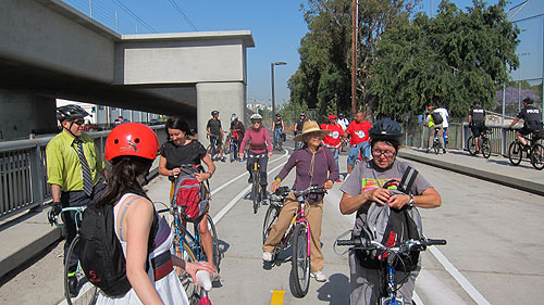 Cyclists stop for a breather at portion of the Expo Bike Lane that merges with the Ballona Creek Bike Path across from the Jefferson/La Cienega Expo Line Station