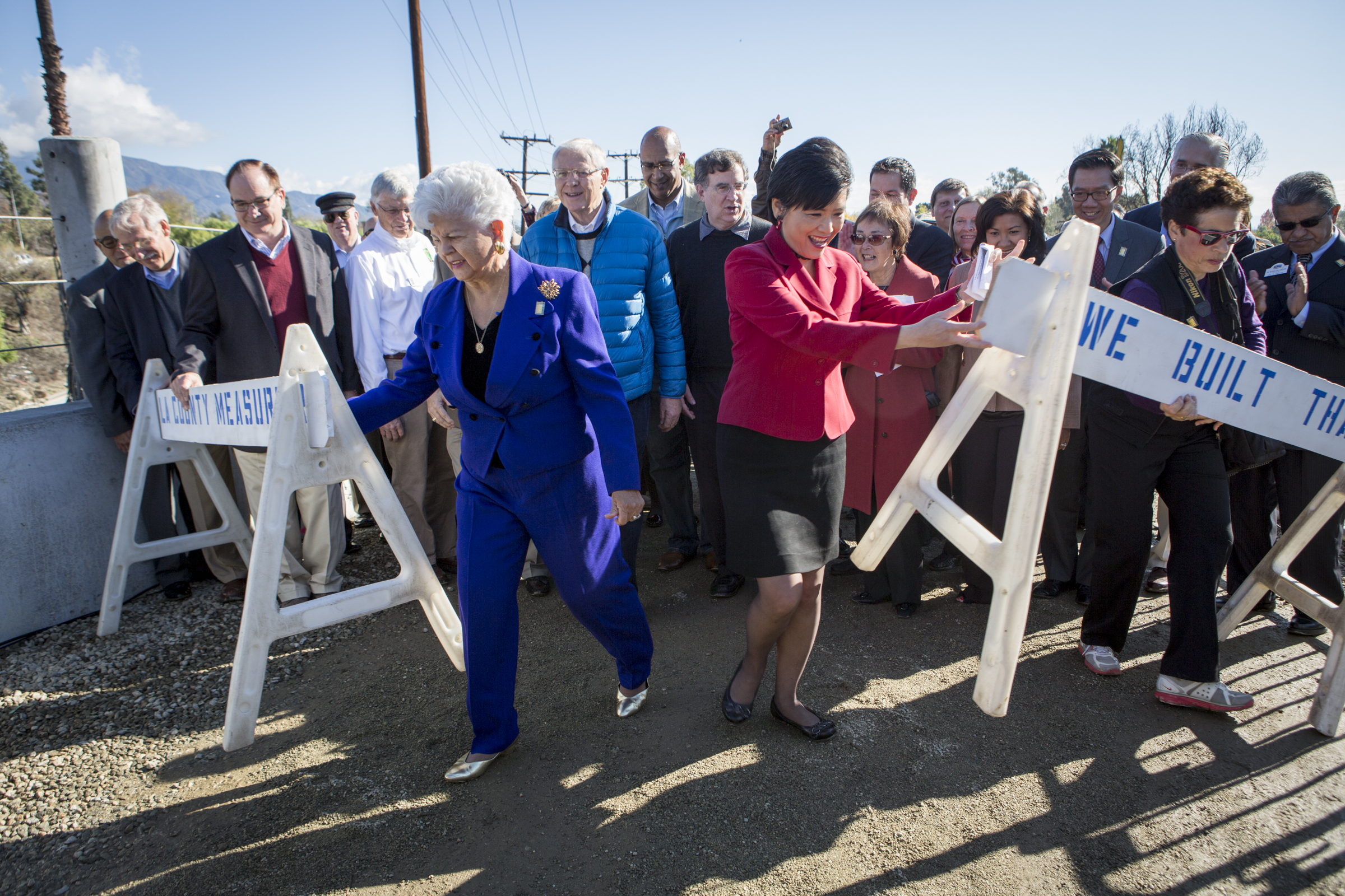 Congress Members Grace Napolitano, left, and Judy Chu at the ceremony for the completion of the bridge. Immediately behind them are Metro Board Chairman Michael D. Antonovich, left, and Metro Board Member John Fasana.