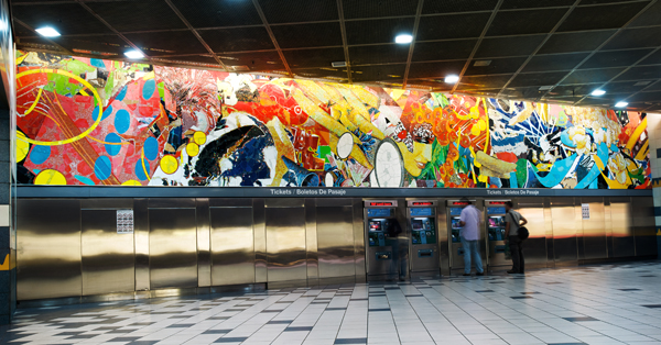 Artist Stephen Johnson's 58-foot long mural, titled Universal Delights, at Universal City Station.