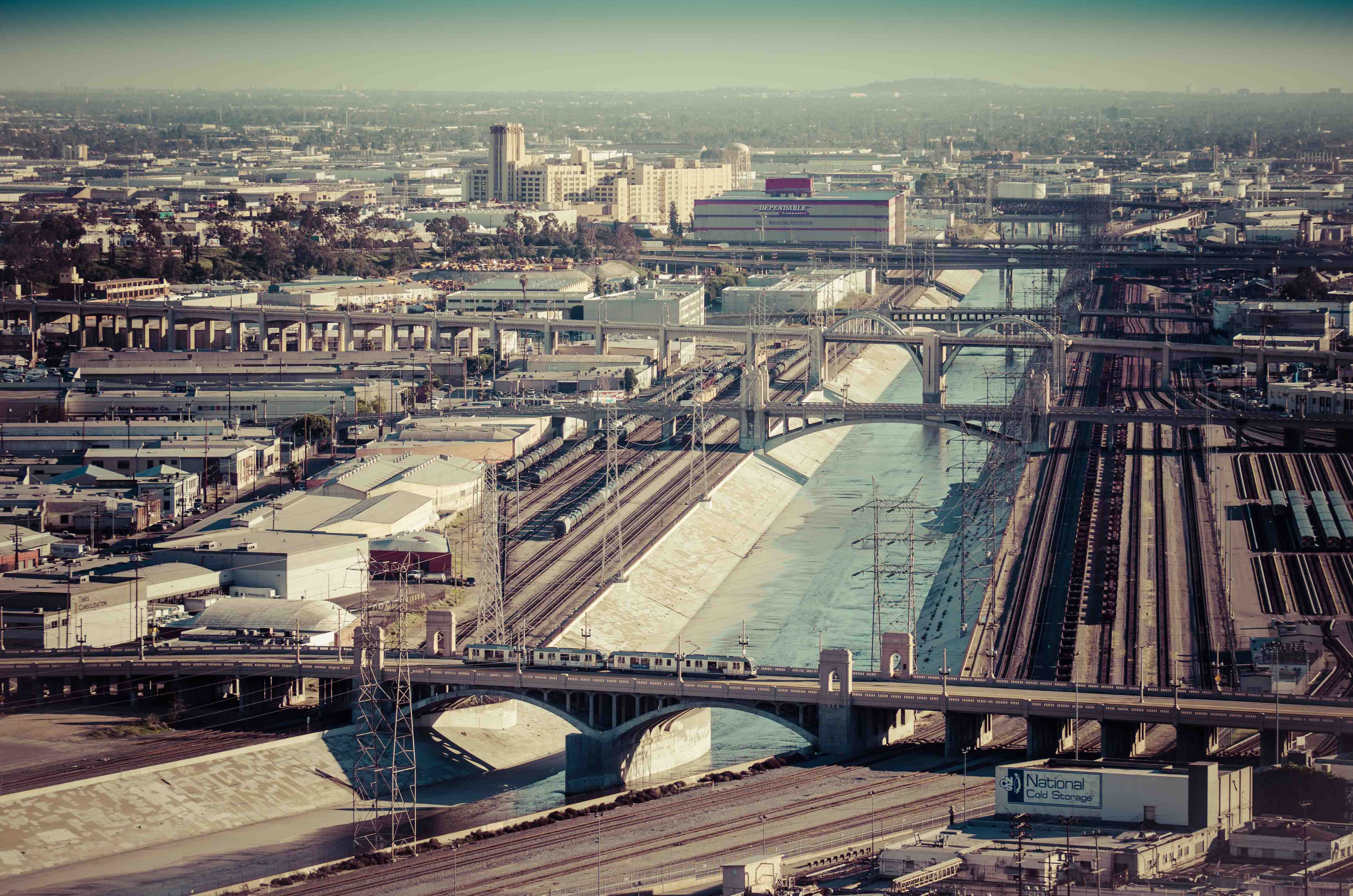 ART OF TRANSIT: A Gold Line train bound for East Los Angeles crosses the 1st Street Bridge over the Los Angeles River on Wednesday afternoon. Click above to see larger. Photo by Steve Hymon/Metro.