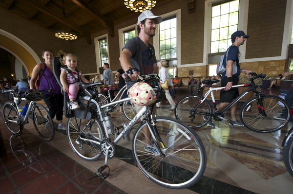Cyclists passing through Union Station to CicLAvia, the car-free "open streets" event that began in 2010. The routes are designed to be Metro accessible and Union Station has been a busy connection point for cyclists and pedestrians on event days. Courtesy of CicLAvia. Photo by Gary Leonard.