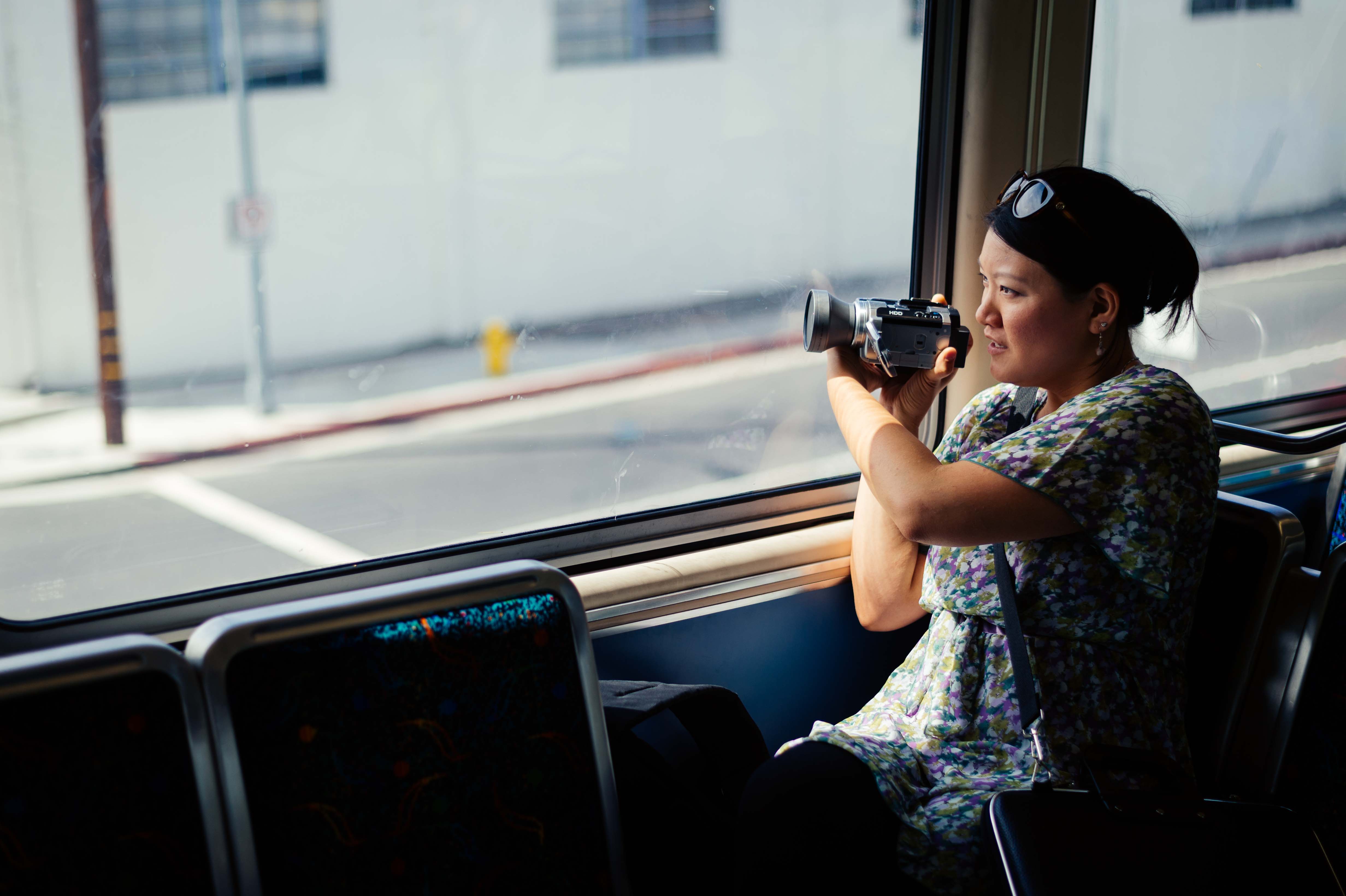 Art of Transit: My colleague Anna Chen collecting footage on the Expo Line for a video to promote ride sharing. Click above for recent posts on Rideshare Week. Photo by Steve Hymon/Metro.