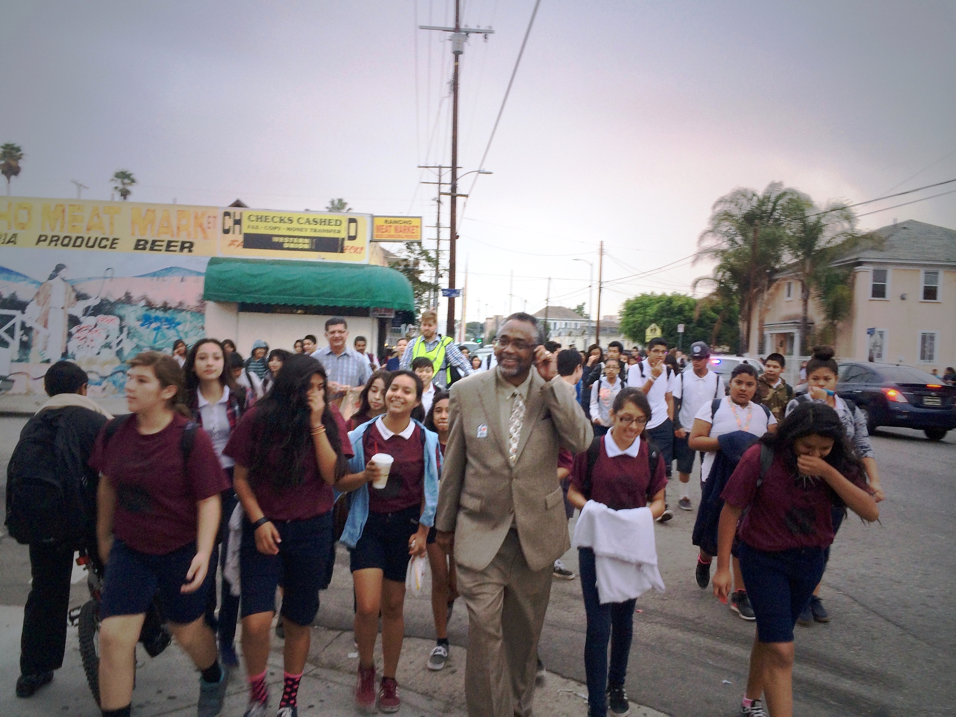 Councilmember Price walking with students