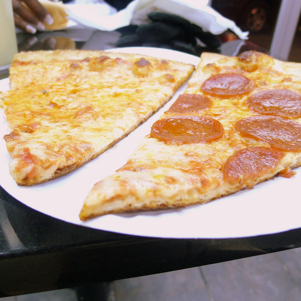 New York pizza slices: pass the Tums please! Photo by Hollywoodsmile310, via Flickr creative commons.