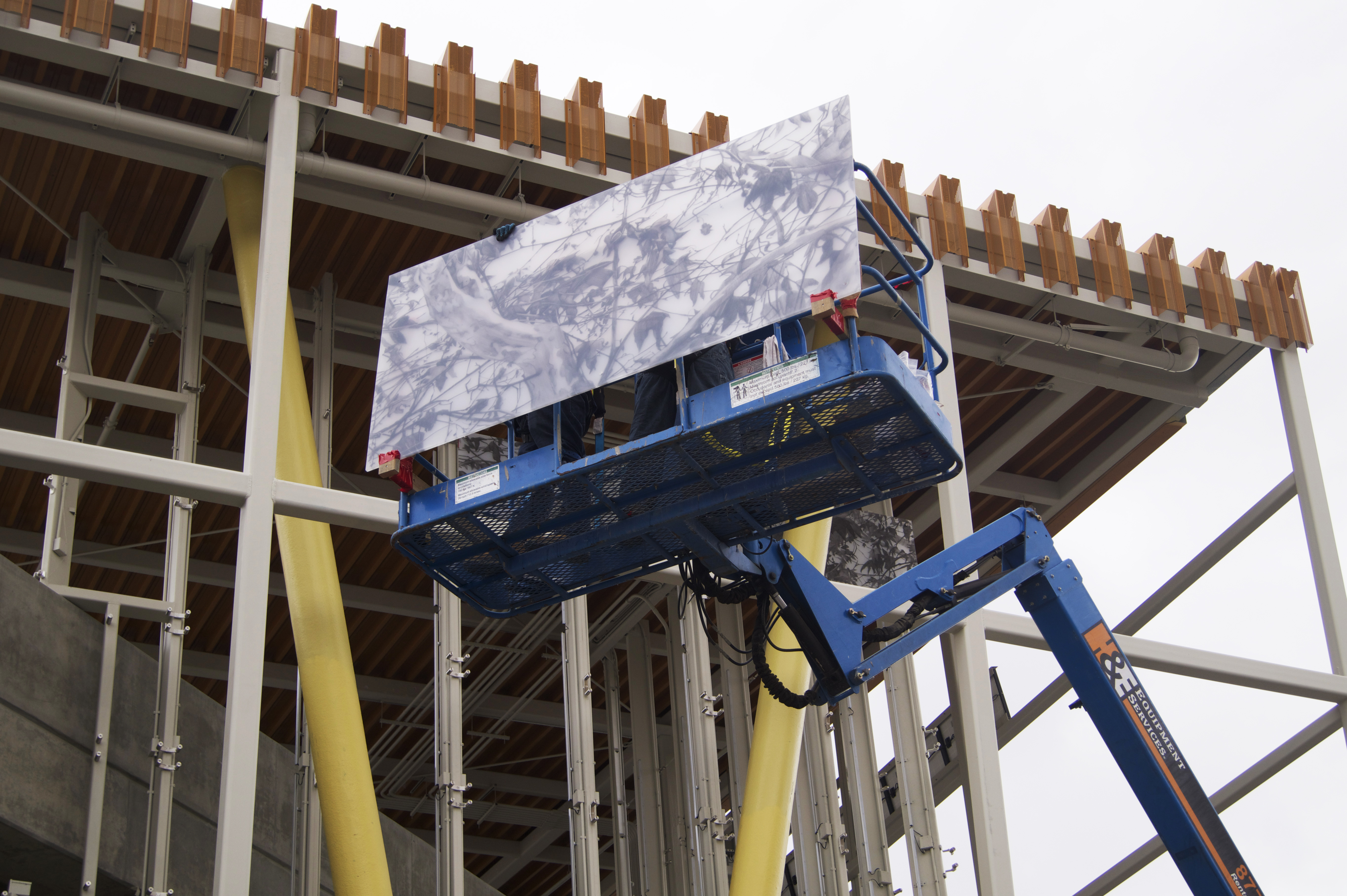 Artwork by Christine Ulke in the process of installation at Division 13 Bus Maintenance and Operations Facility. The artwork will improve the quality of a high visibility street intersection across the street from Union Station.