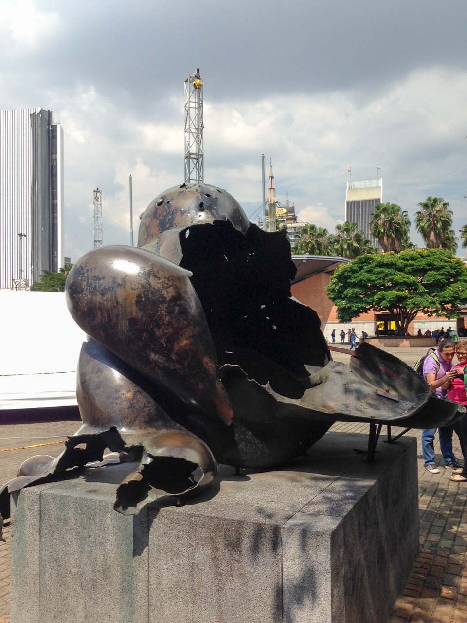 A sculpture near a Metro stop that was damaged by a grenade attack in 1995. It was left in place with a new sculpture -- representing the new Colombia -- installed nearby.