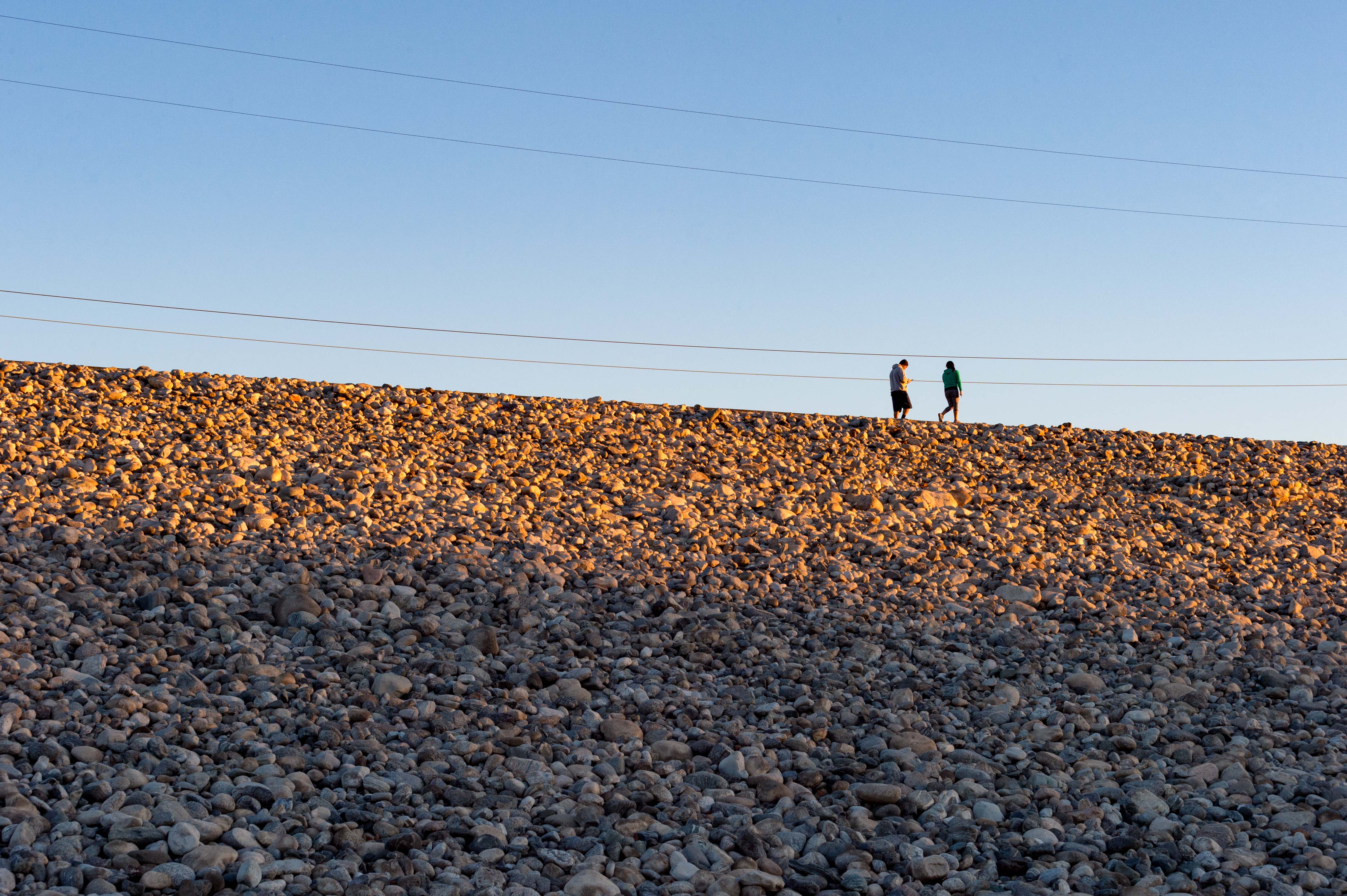 Walkers on the path atop the Santa Fe Dam in Irwindale. Photo by Steve Hymon/Metro.