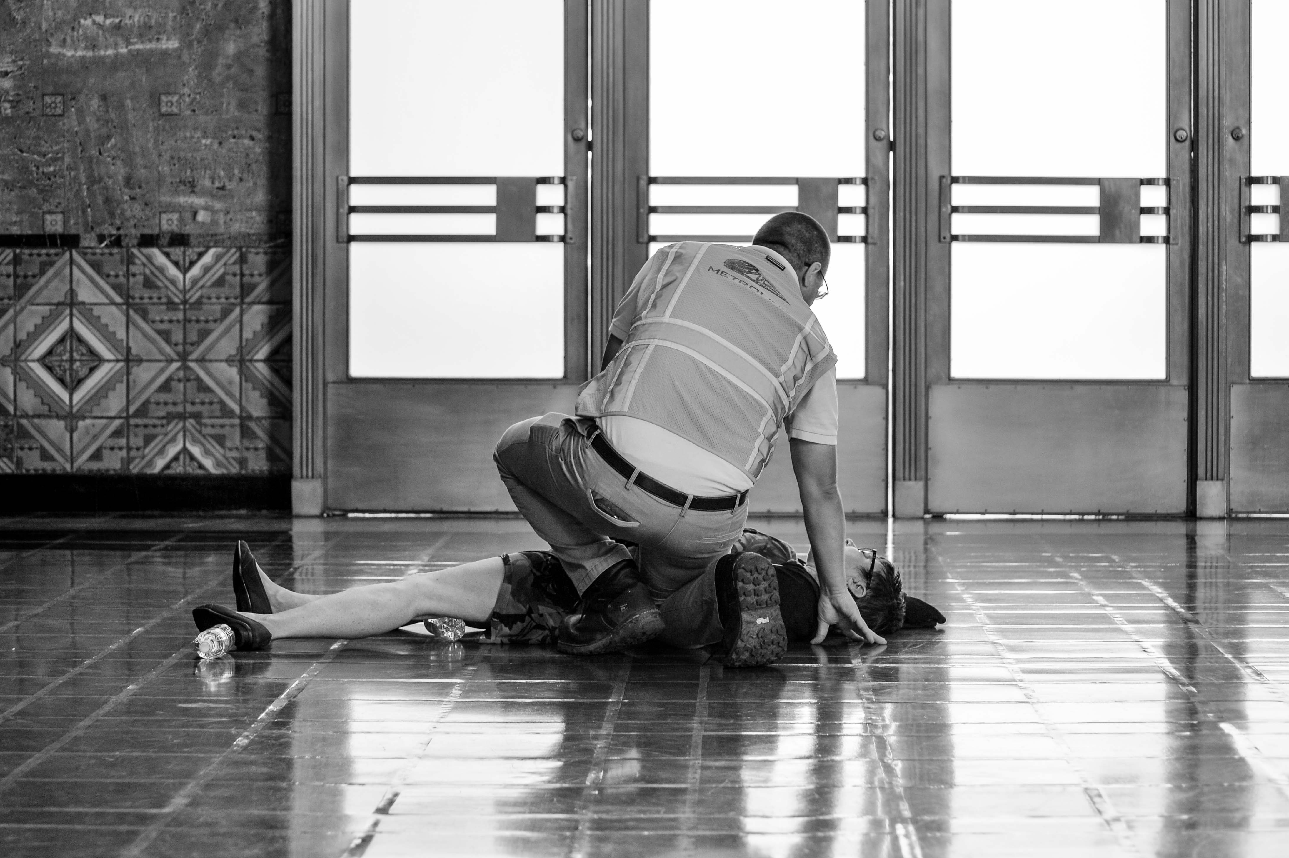 Oh no! Actually, no fear -- this was part of a safety drill this morning in the old ticketing hall in Union Station. This woman was pretending to have a baby to see how station employees and law enforcement would react. Photo by Steve Hymon/Metro.