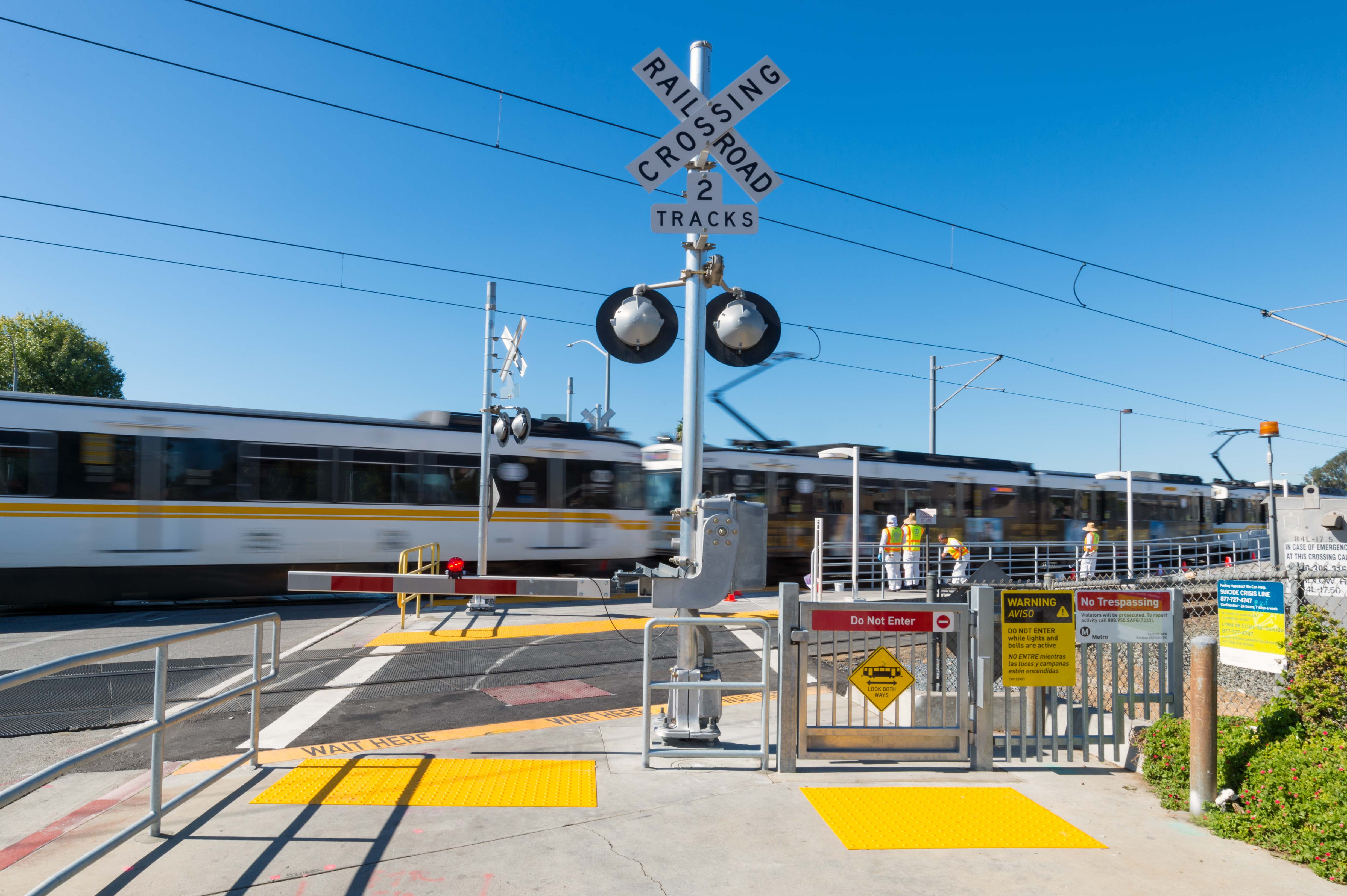New gates designed to slow and/or stop pedestrians from crossing the tracks at the Blue Line's Wardlow Station. Photo by Steve Hymon/Metro.