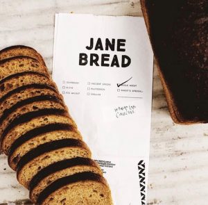 Sliced bread on top of paper bag packaging
