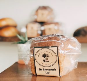 Bagged loaf of bread on wooden table